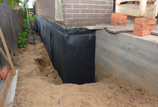 SJ Waterproofing Pros technician performing targeted Interior Drainage System assessment in Lancaster, NY